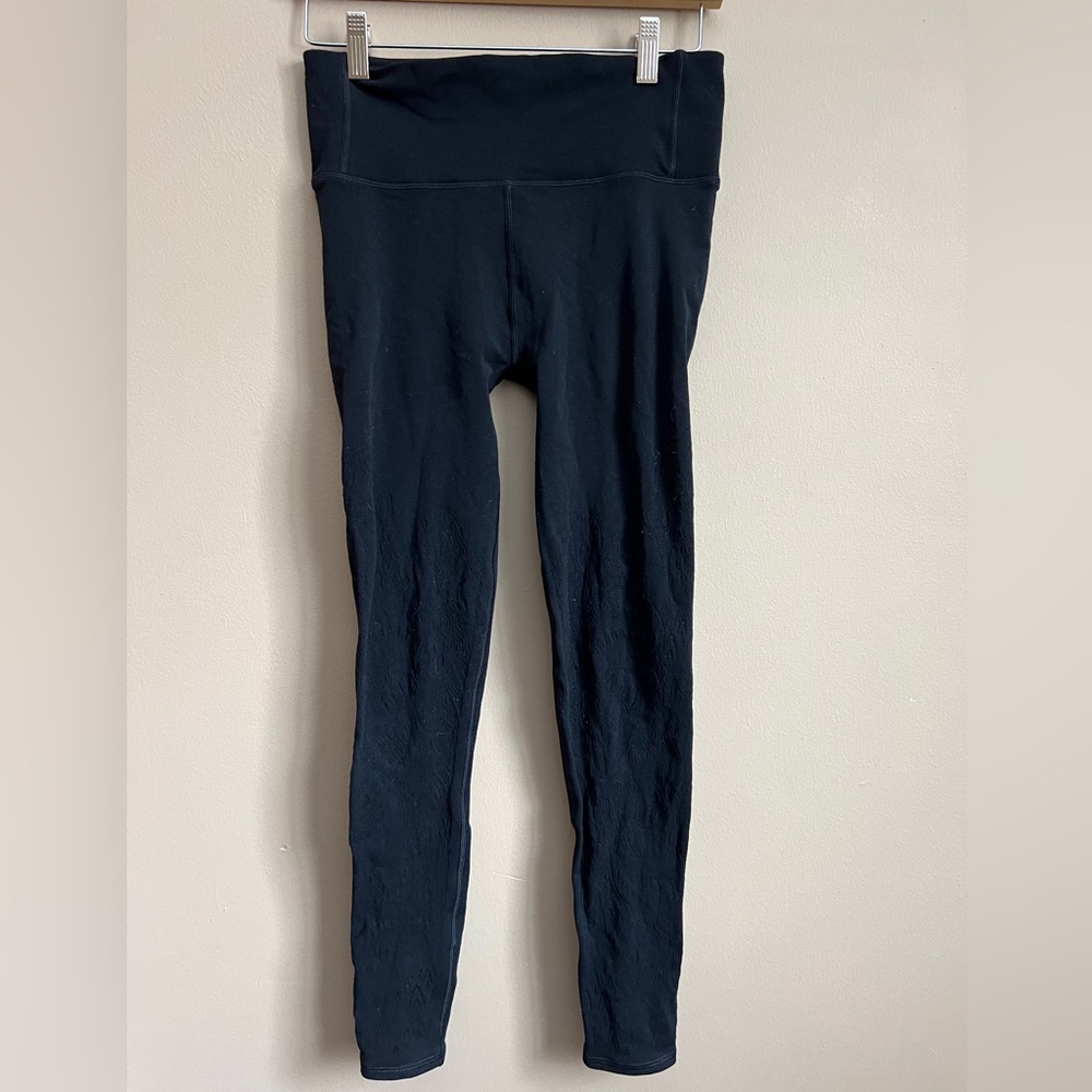 Lululemon black tight leggings. Lace detail. size 8